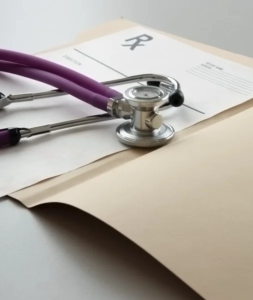 Closeup of a stethoscope on a rx prescription. — Stock Photo, Image