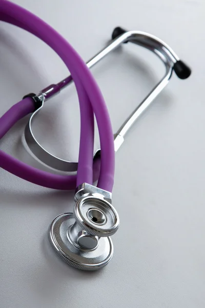 A stethoscope on white, closeup. — Stock Photo, Image