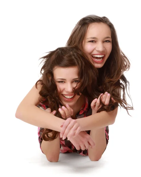 Two pretty college girls lying on the floor. — Stock Photo, Image