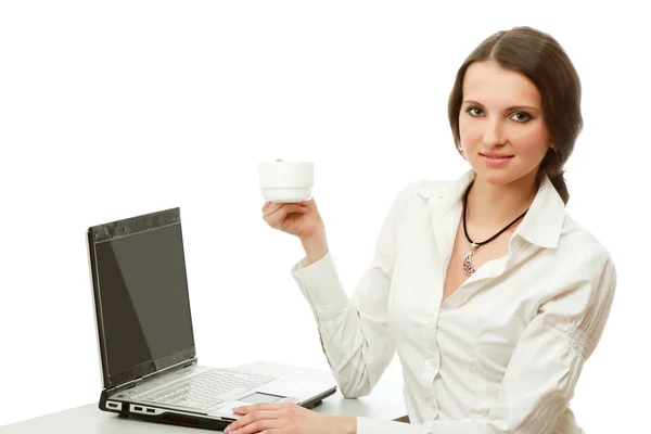 A young woman sitting in front of a laptop — Stock Photo, Image