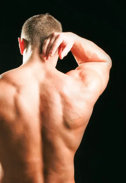 Muskulöser Mann mit Nackenschmerzen — Stockfoto