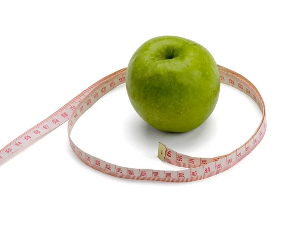 一个绿色的苹果和测量磁带 — 图库照片