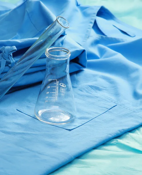 Test tubes on a medical uniform — Stock Photo, Image