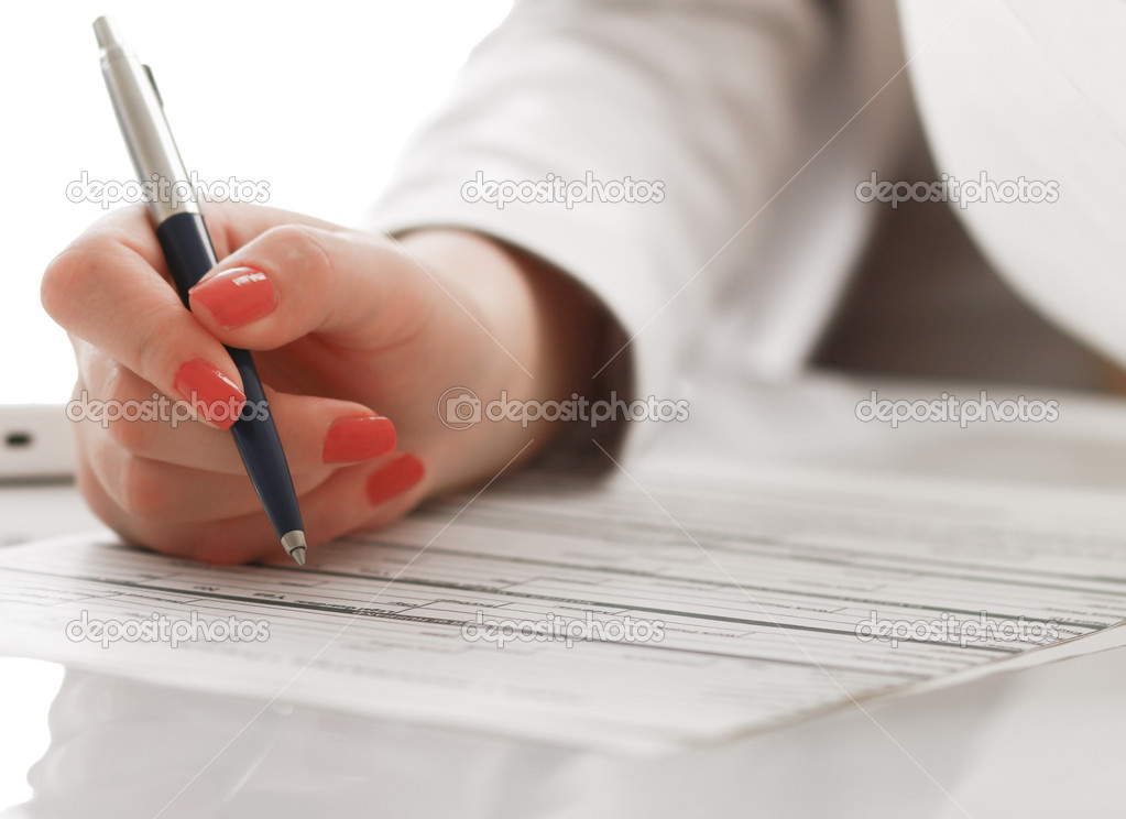 Business woman working with tax documents.