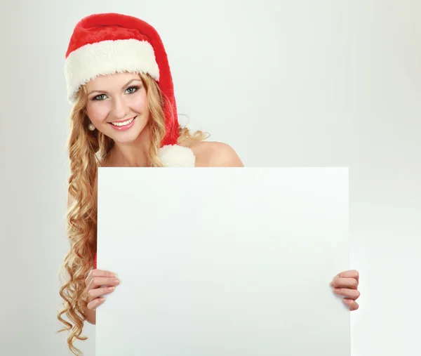 Woman wearing a santa hat — Stock Photo, Image