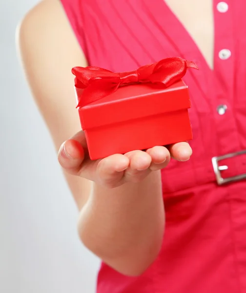 Woman holding gift box Stock Picture