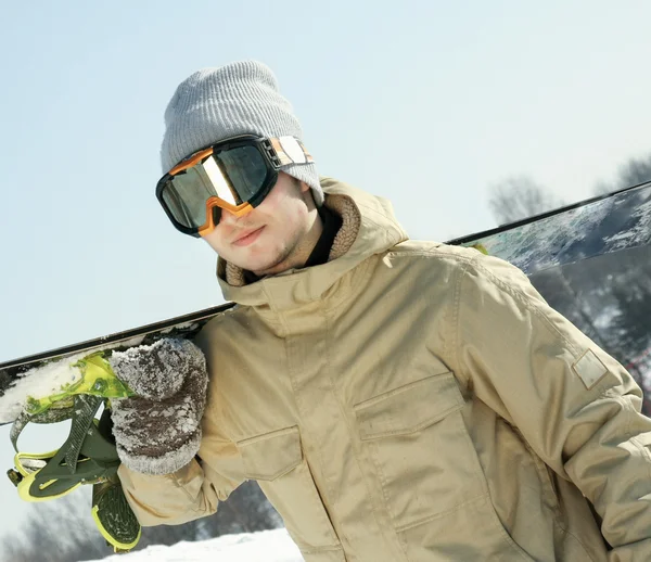 Snowboarder standing with board. — Stock Photo, Image