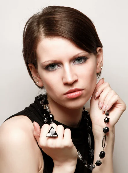 Woman is holding a beads — Stock Photo, Image