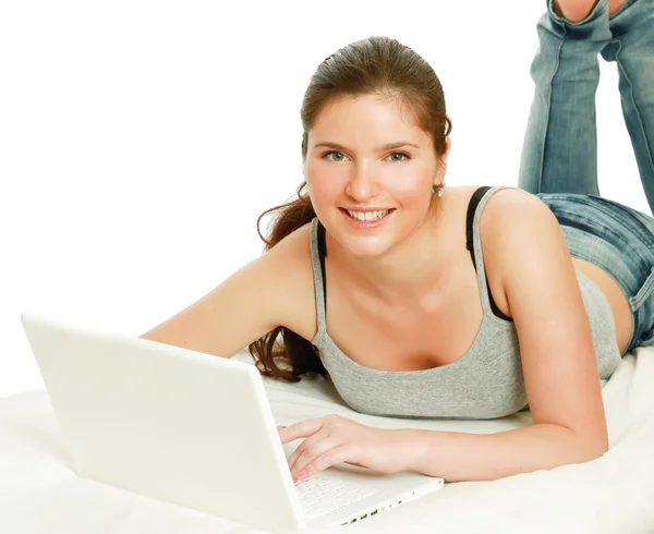 A smiling woman working with a laptop Royalty Free Stock Photos