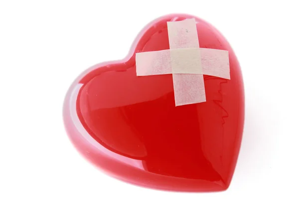Червоне серце з клейкою штукатуркою — стокове фото