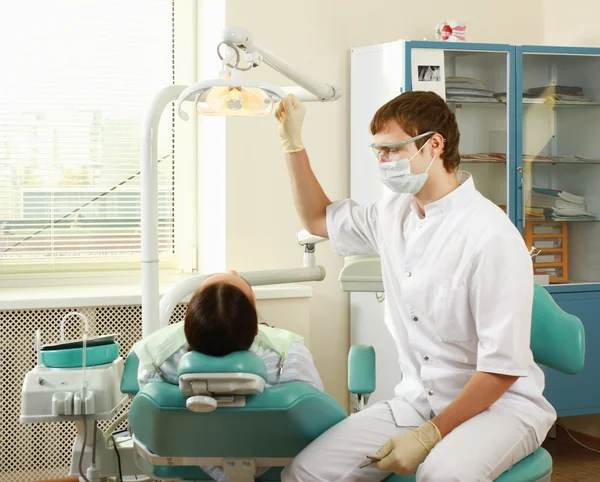 Young woman with dentist — Stock Photo, Image