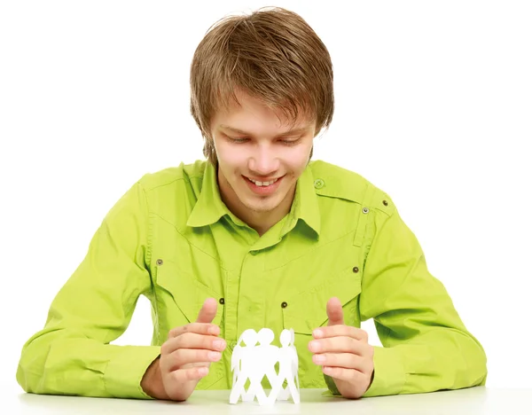 Guy   holding paper people — Stock Photo, Image