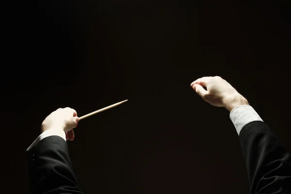 Concert conductor with a baton — Stock Photo, Image