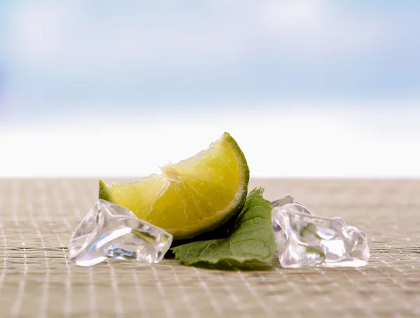 Lime and meelting ice — Stock Photo, Image