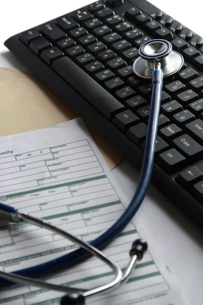 A stethoscope on a laptop computer — Stock Photo, Image
