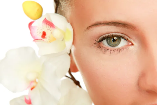 A young woman with orchid — Stock Photo, Image