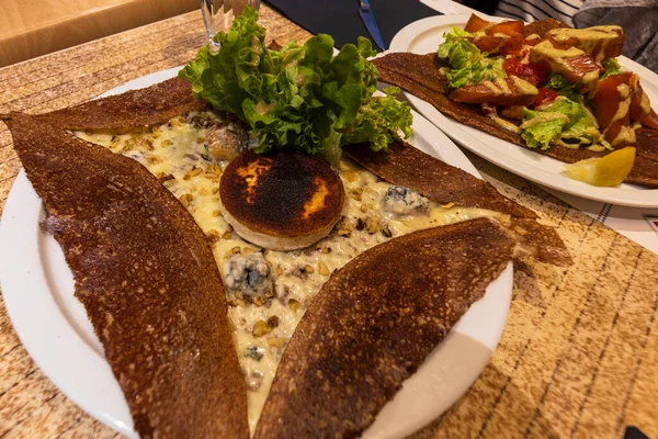 Cheese galette typical food in France. Galette bretonne, a French dish consumed throughout France. Originally from Brittany, St. Michael\'s mountain