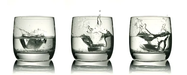 Three glasses with ice cube — Stock Photo, Image