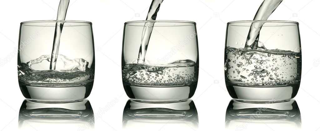 Three glasses with a water jet