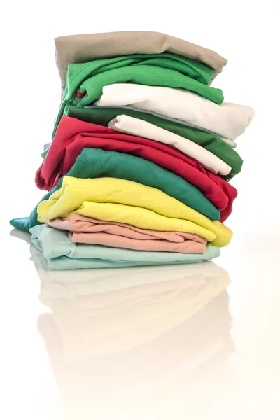 Pile of shirts isolated — Stock Photo, Image