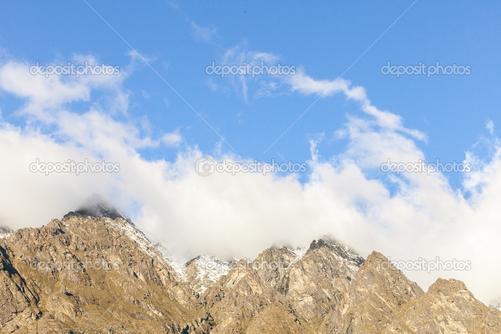 Mountain peaks covered in clouds