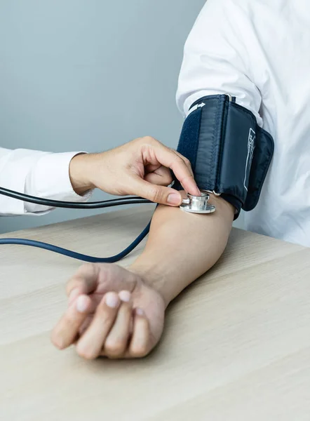 Doctor Evaluates Patient Stethoscope Blood Pressure Monitor Records Results Health — Foto de Stock
