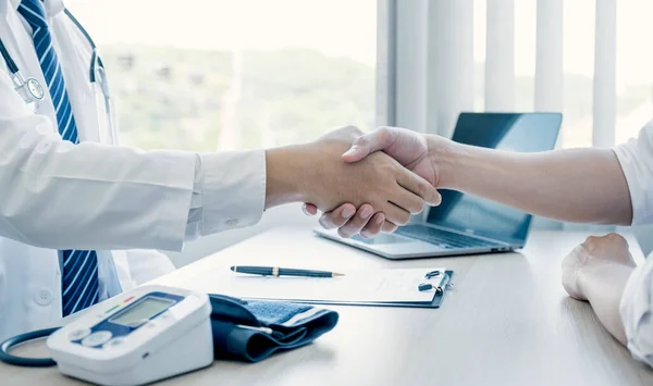 Handshake after doctor explained the health examination results to the patient, medical checkup concept.