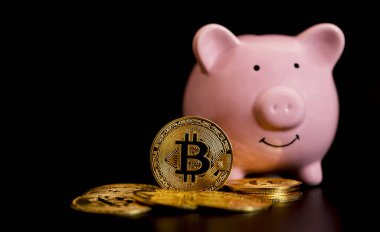 The bitcoins stand in front of pink piggybank. risk and wealth can happen in investment savings or trading in cryptocurrency innovation.