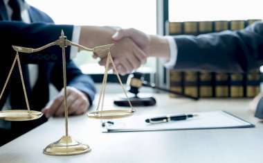 justice scale, Handshake after Lawyer  providing legal consult business dispute service to the man at the office with gavel hammer.