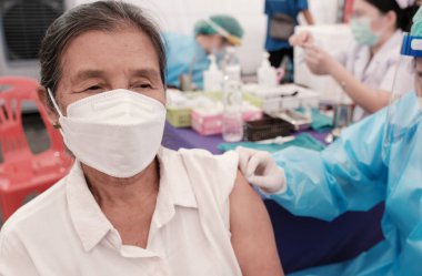 Asia senior woman has gone to vaccinate coronavirus covid19 with medical staff in a field hospitel. a place set up by the government.