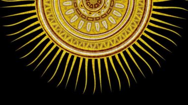 Rotating golden mosaic sun over black