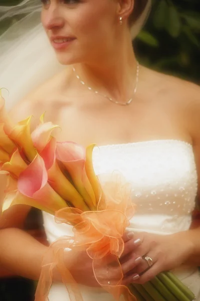 Close up portrait of a bride with flowers — Stock Photo, Image