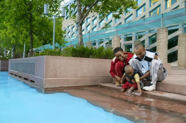 Young Family By Water — Stock Photo, Image