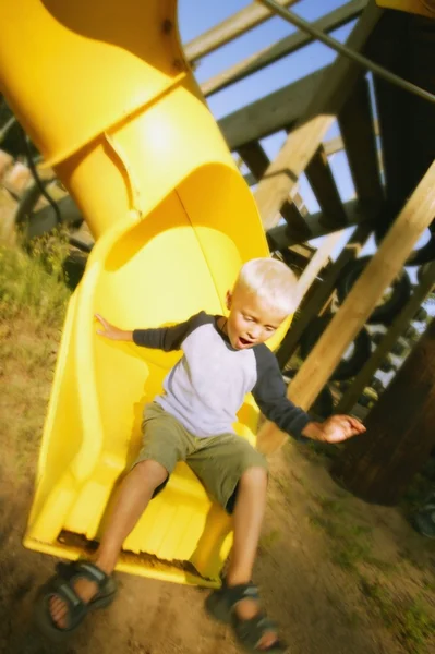 Boy Goes Down A Slide — Stock Photo, Image