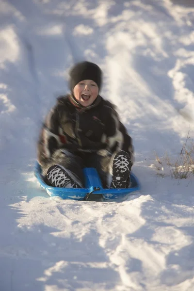 Rapaz Tobogganing — Fotografia de Stock