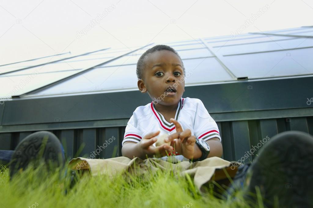 Black boy Sitting On The Grass