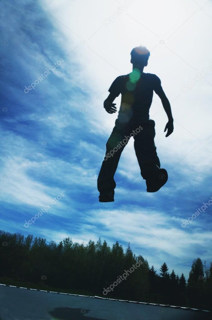 Man Jumping On A Trampoline