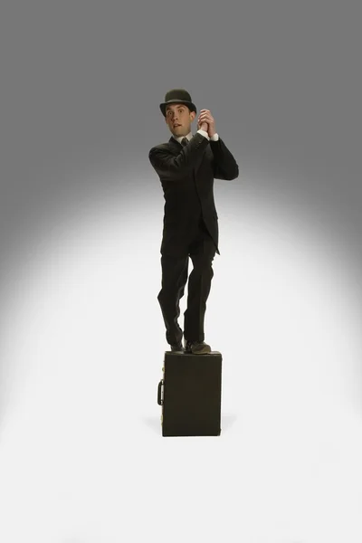 A Winning Businessman Stands On His Briefcase — Stock Photo, Image