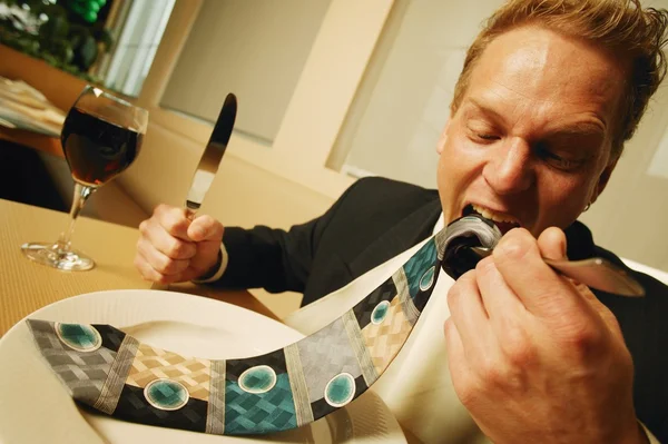 Businessman Eating His Necktie — Stock Photo, Image