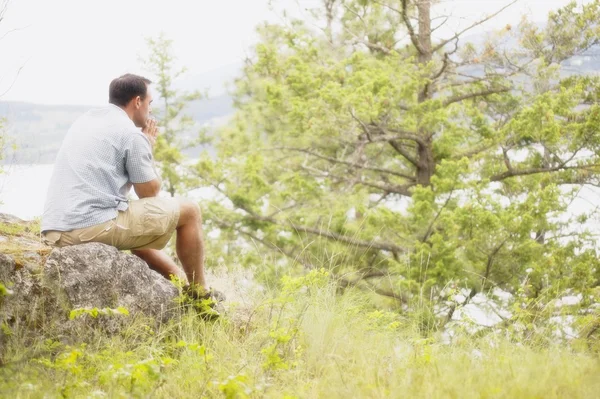 Man Sits Absorbing The Beauty — Stock Photo, Image