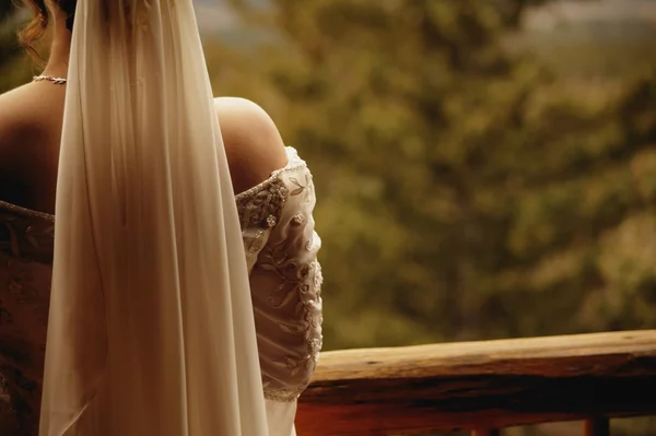 Bride Looks Over Balcony — Stock Photo, Image