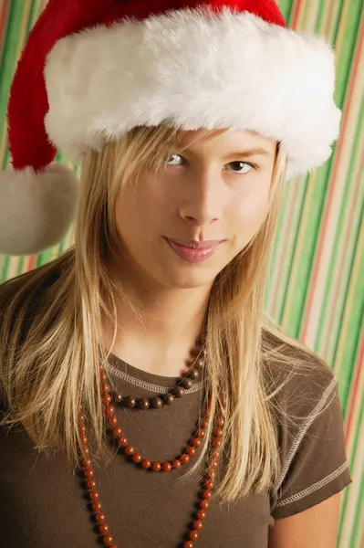 Flicka klädd santa hatt — Stockfoto