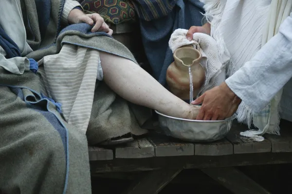 Gesù lava i piedi del discepolo Foto Stock Royalty Free