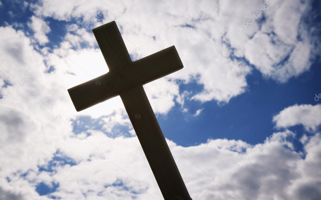 A Cross Silhouetted Against Clouds