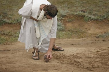 Jesus Drawing In The Sand clipart