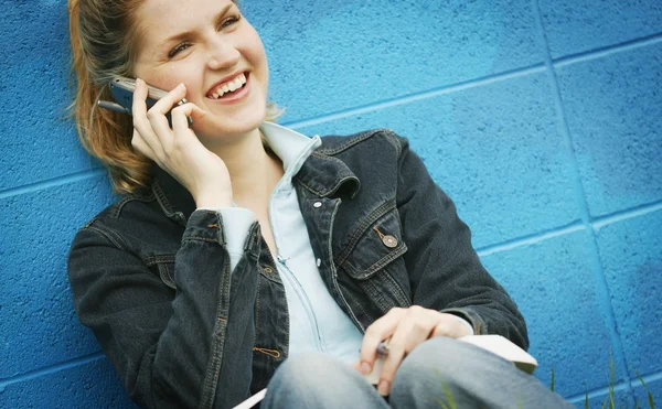 Student With Textbook And Cell Phone — Stock Photo, Image