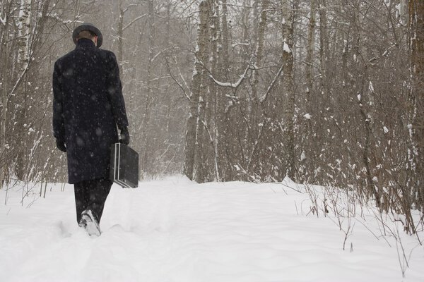 Businessman Walking Through The Snow