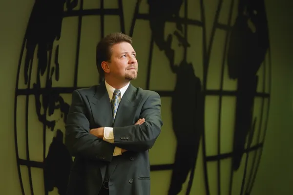 Businessman With Image Of World In Background — Stock Photo, Image