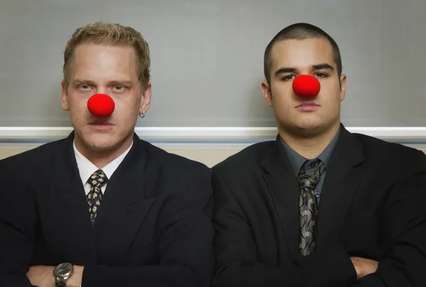 Businessmen Wearing As Red Nose Looking Serious — Stock Photo, Image