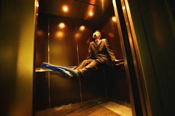 Businessman With Flippers & Goggles On In Elevator — Stock Photo, Image